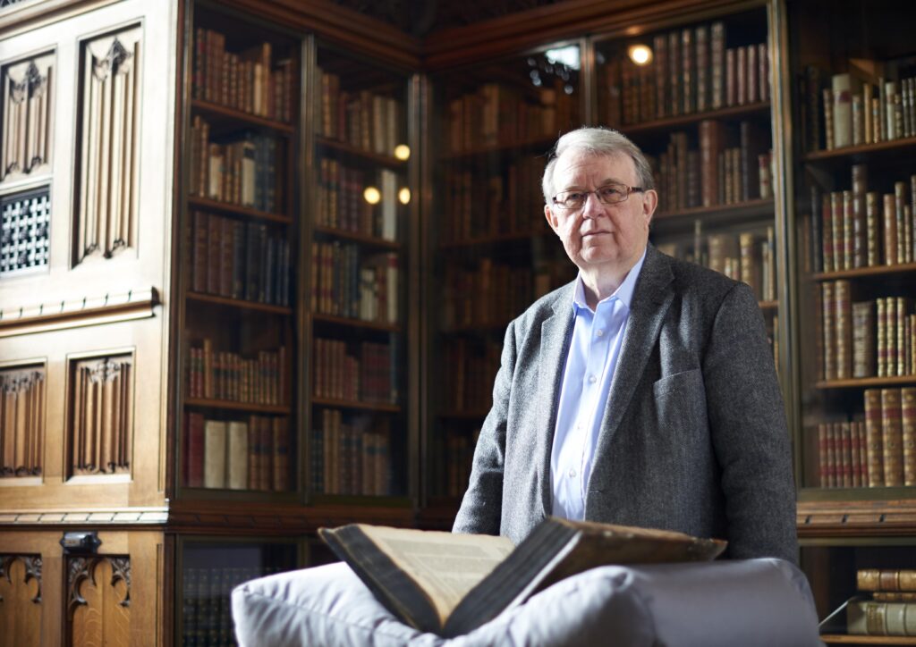 Professor Philip Alexander in the Rylands Library, University of Manchester.